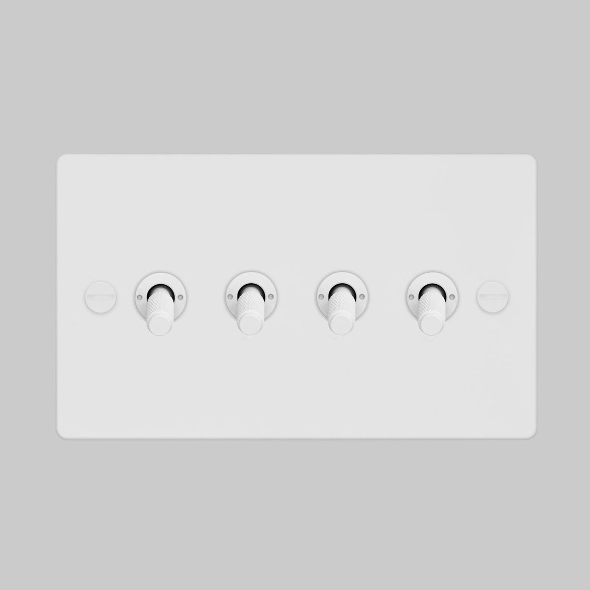Four Gang 2 Way Light Switch in White with Cross Cut Knurled Toggles