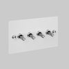 Four Gang 2 Way Light Switch in White with Steel Cross Cut Knurled Toggles