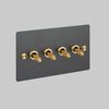 Four Gang 2 Way Light Switch in Smoked Bronze with Brass Cross Cut Knurled Toggles