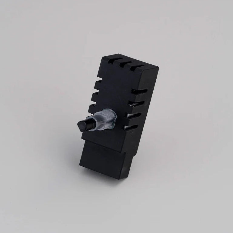 Black rectangular device with a clear plastic and black knob on one side