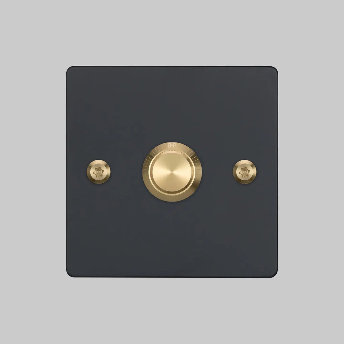 Buster and Punch one gang two way dimmer light switch in black with brass linear knurled knob