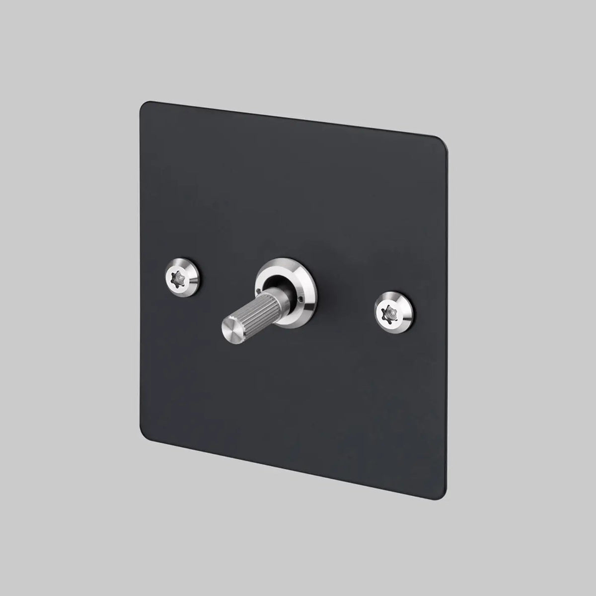 Buster and Punch one gang two way light switch in black with steel linear knurled toggle