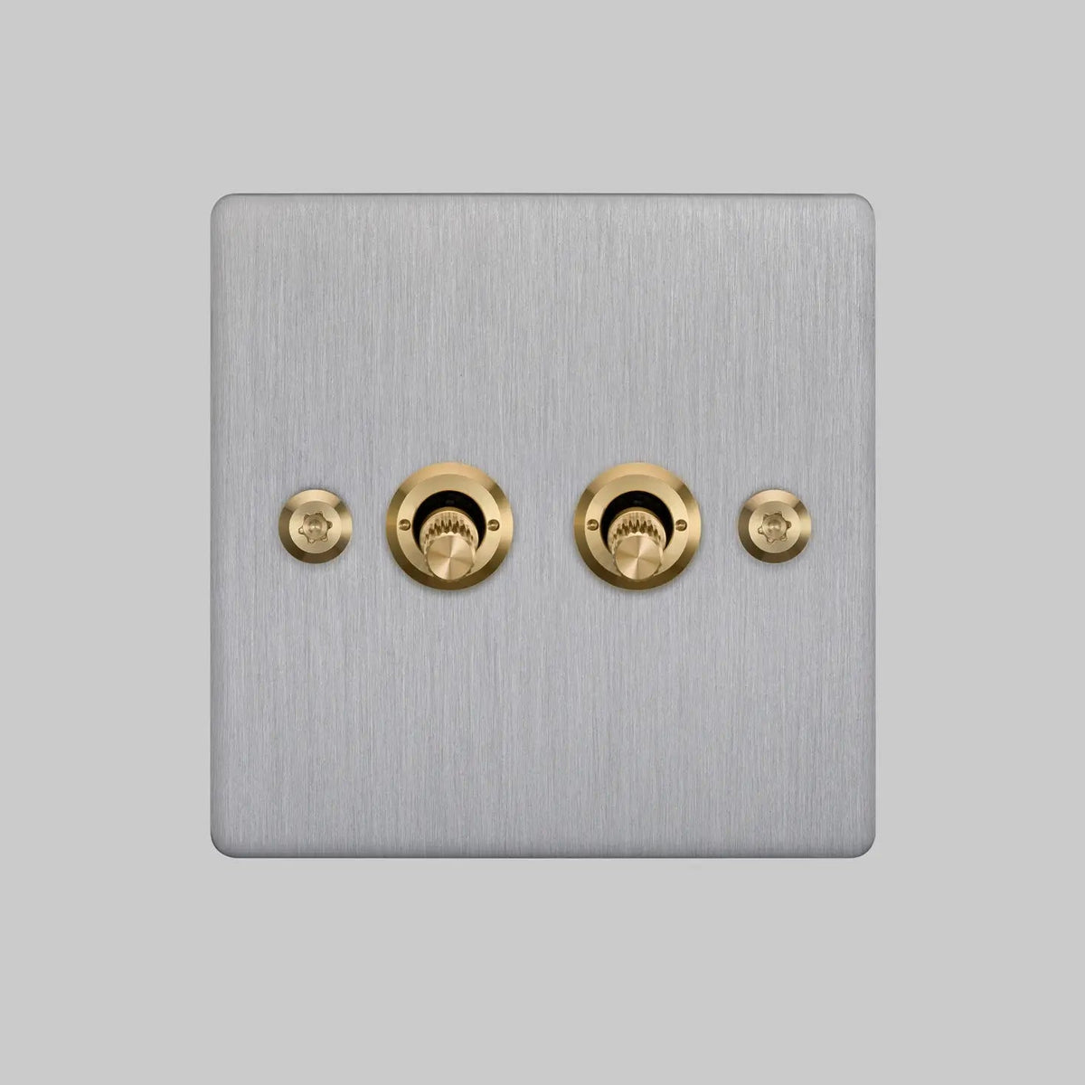 Buster and Punch two gang two way light switch in steel with brass linear knurled toggles