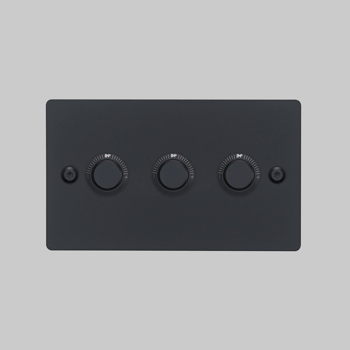 Black dimmer switch with three rotary controls and two screws