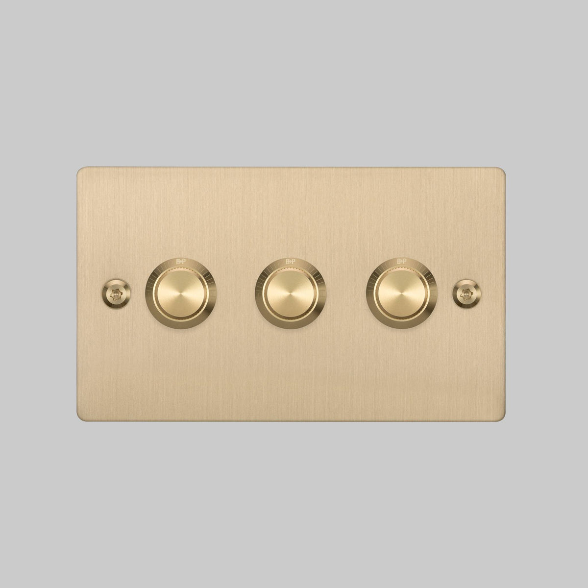 Brushed brass 3-gang dimmer switch with B+P branding