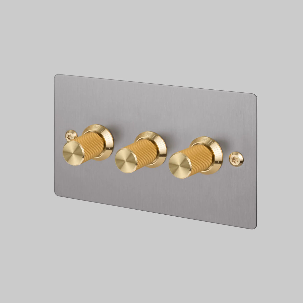 Three Gang 2 Way Dimmer Light Switch in Steel with Brass Linear Knurled Knobs