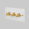Three Gang 2 Way Dimmer Light Switch in White with Brass Linear Knurled Knobs