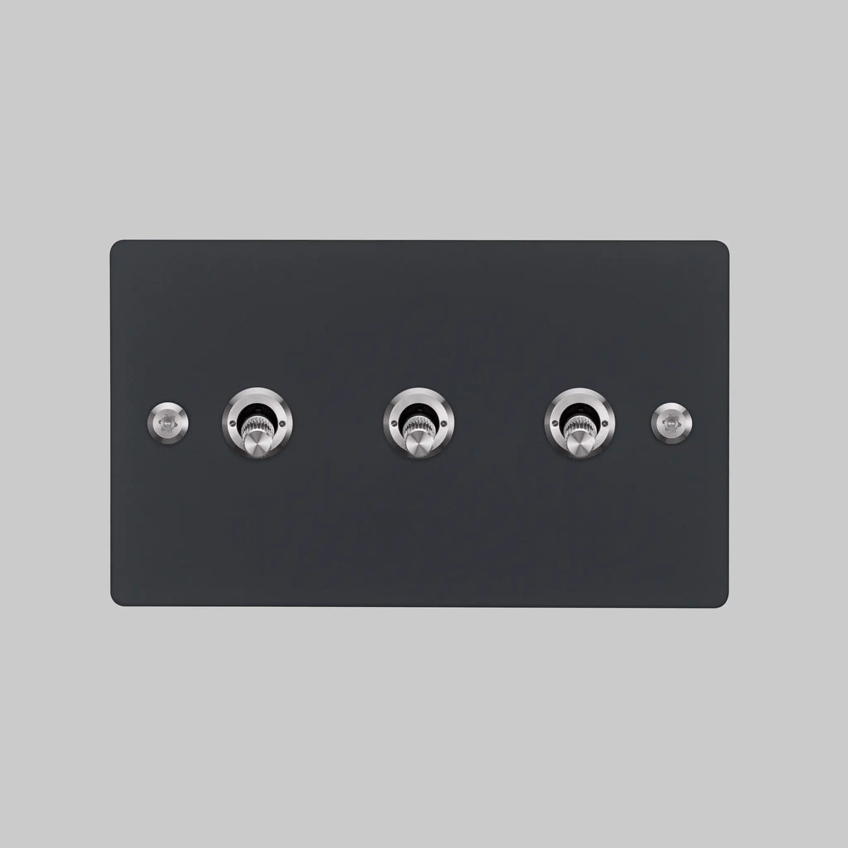 Buster and Punch three gang two way light switch in black with steel linear knurled toggles