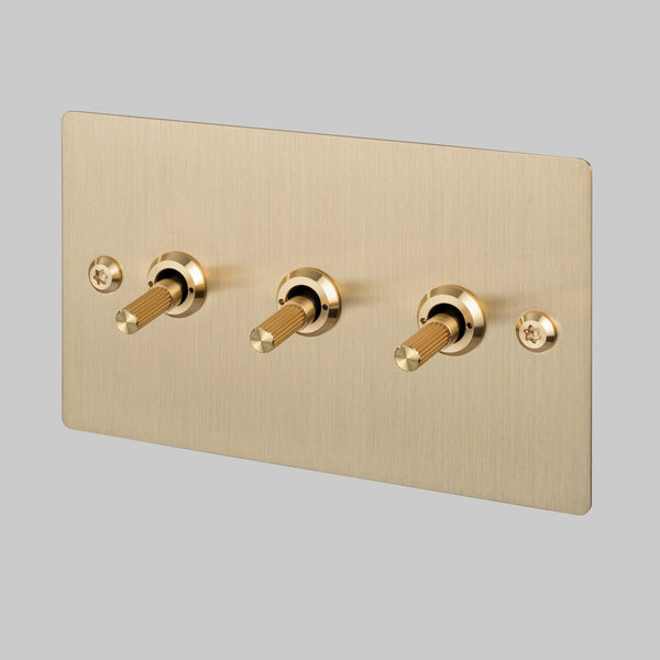 Three Gang 2 Way Light Switch in Brass with Linear Knurled Toggles