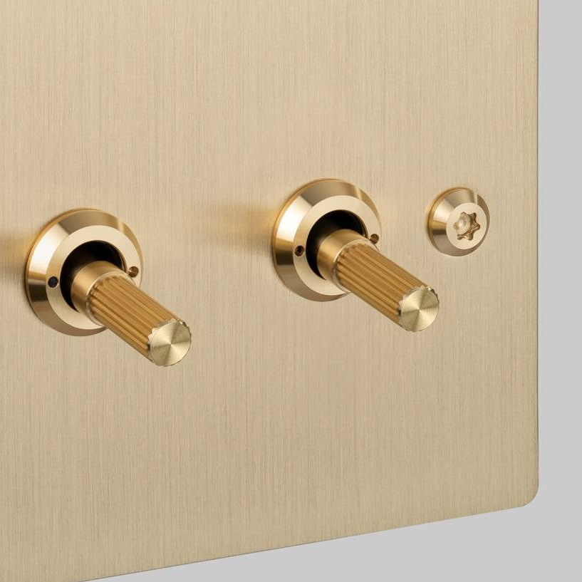 Three Gang 2 Way Light Switch in Brass with Linear Knurled Toggles