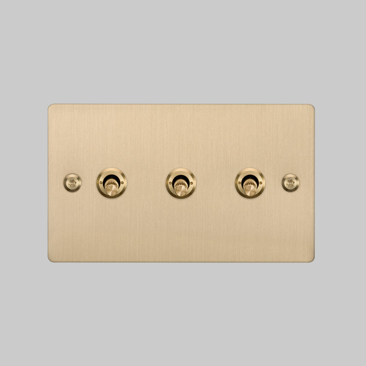 Three Gang 2 Way Light Switch in Brass with Linear Knurled Toggles