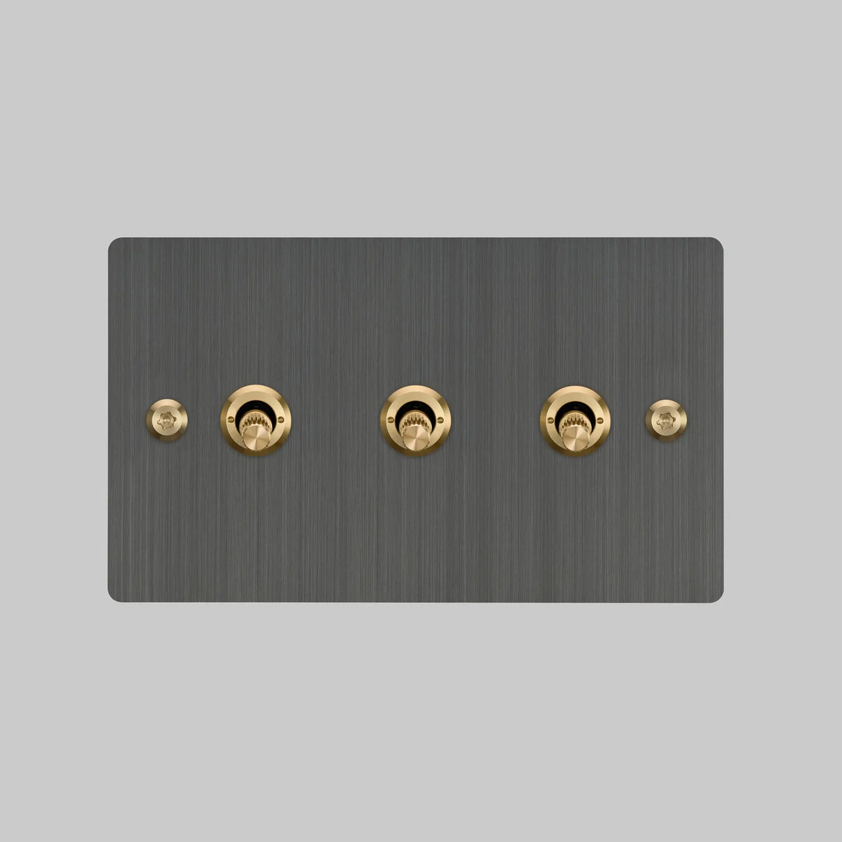 Buster and Punch three gang two way light switch in smoked bronze with brass linear knurled toggles