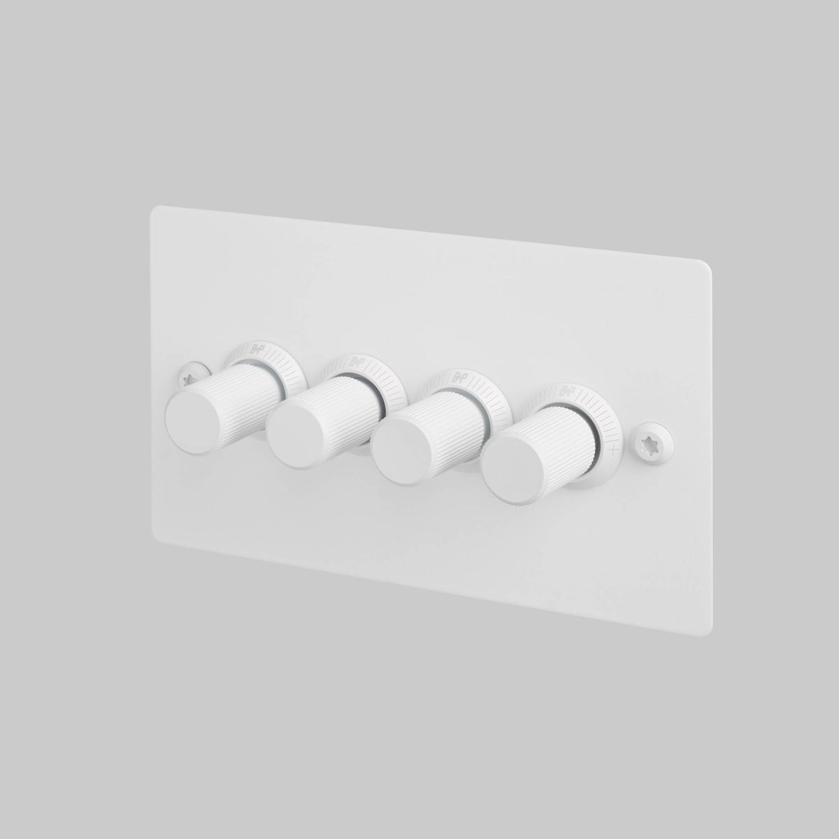 White four-gang dimmer switch with ridged cylindrical knobs and visible screws