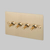 Four Gang 2 Way Light Switch in Brass with Linear Knurled Toggles