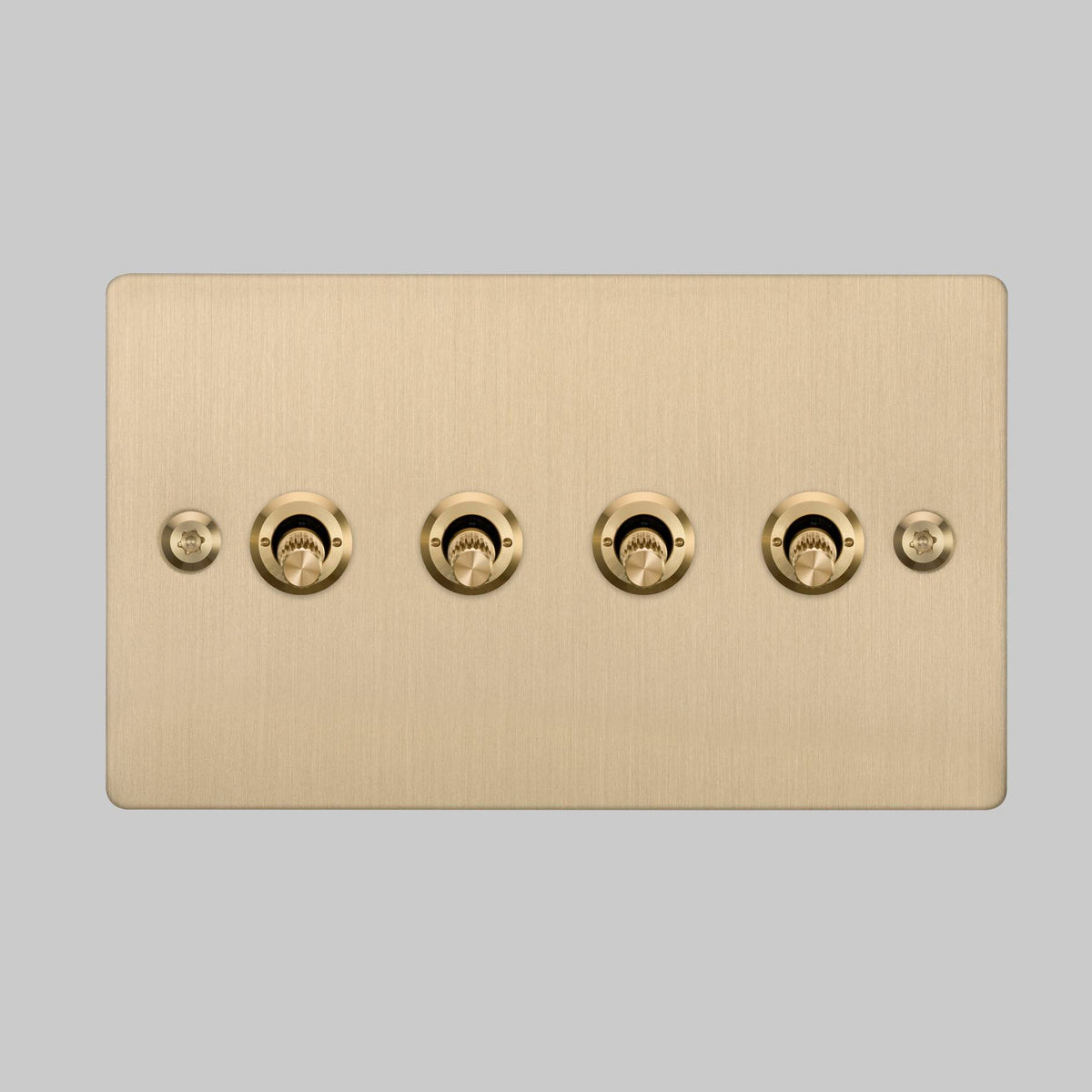 Four Gang 2 Way Light Switch in Brass with Linear Knurled Toggles