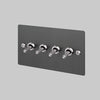 Four Gang 2 Way Light Switch in Smoked Steel with Brass Linear Knurled Toggles