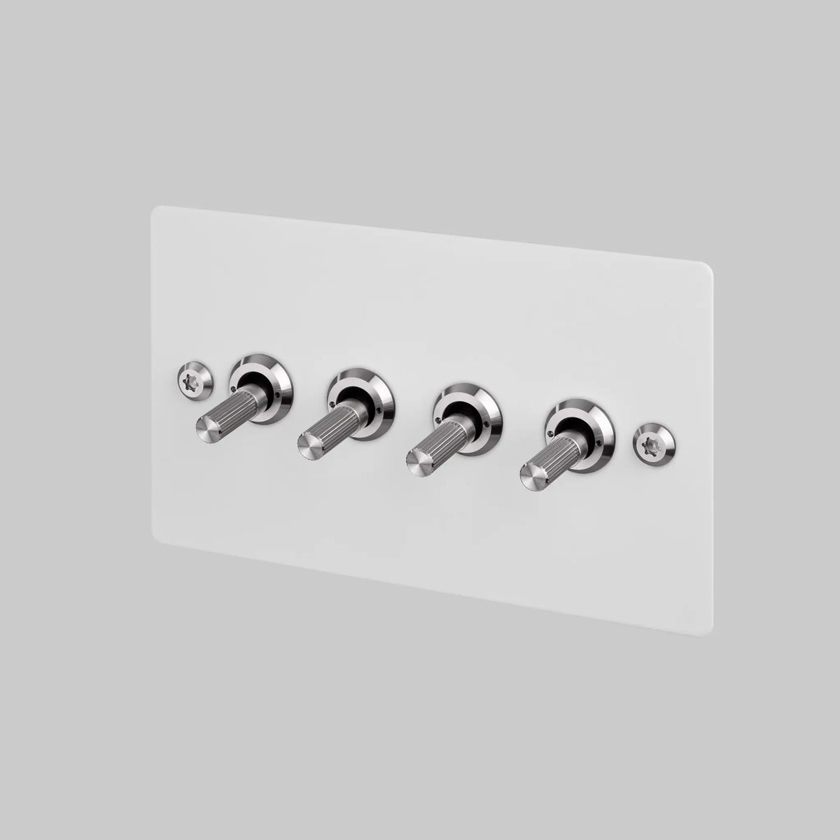 Buster and Punch four gang two way light switch in white with steel linear knurled toggles