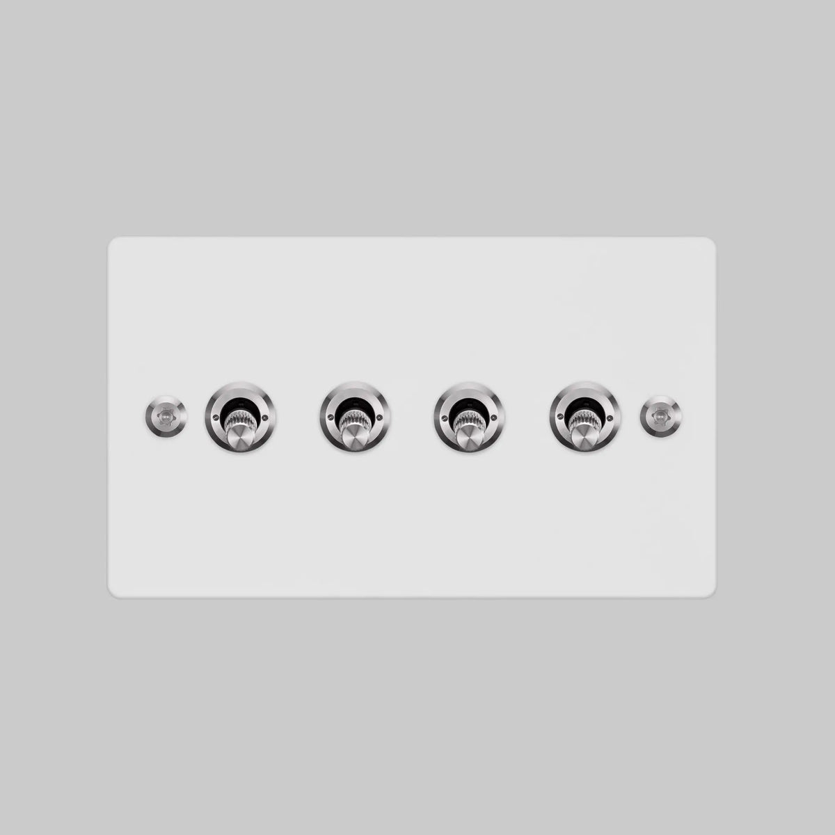 Buster and Punch four gang two way light switch in white with steel linear knurled toggles