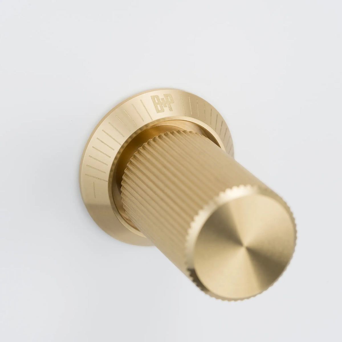 Buster and Punch brass linear knurled dimmer knob on white background