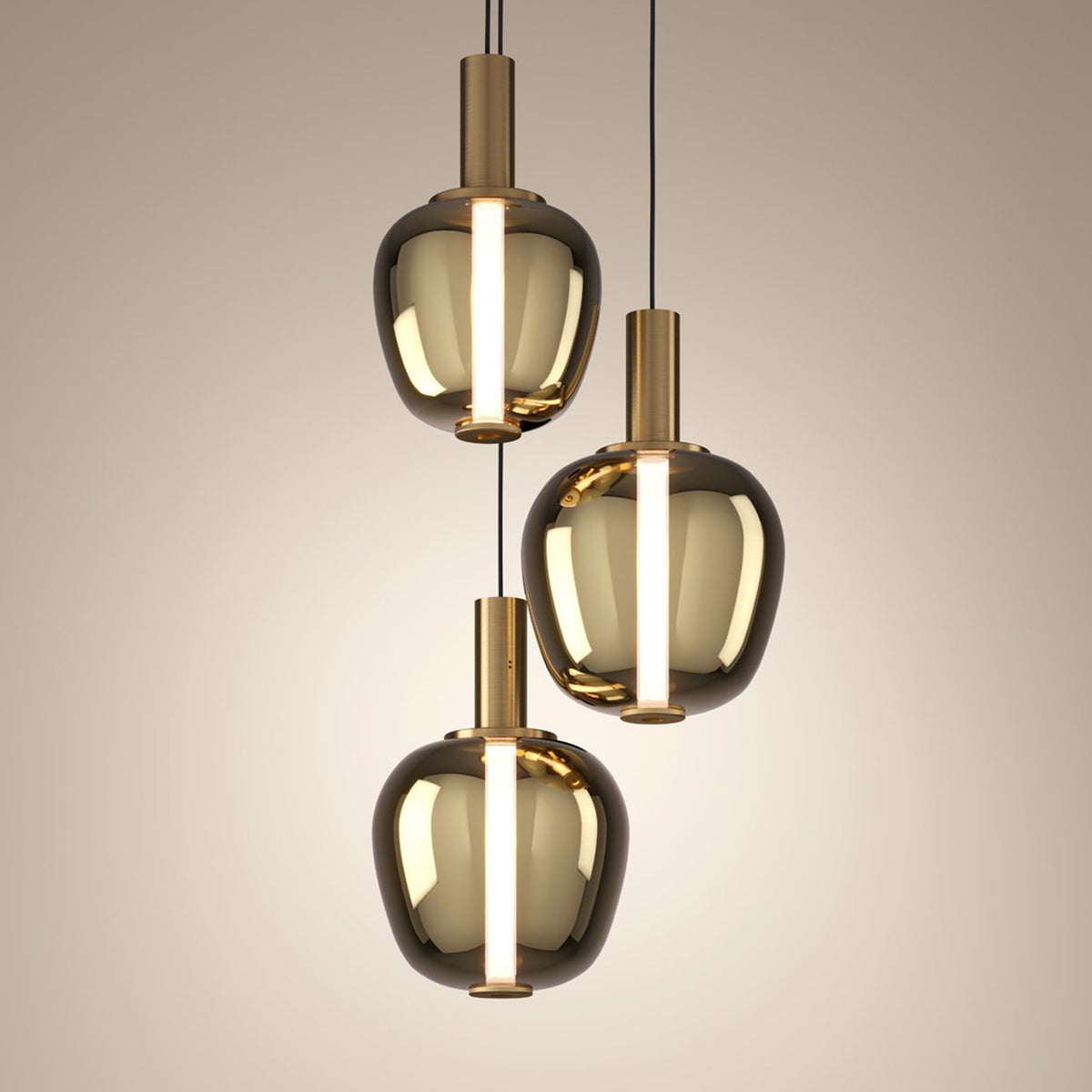 Three modern pendant lights with smoked glass shades and brass accents hang from the ceiling.