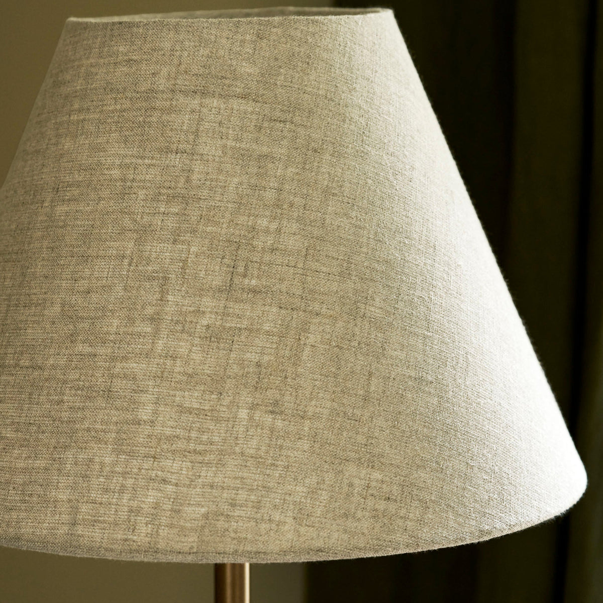 Close up of the Winsley brass and marble table lamp natural linen shade