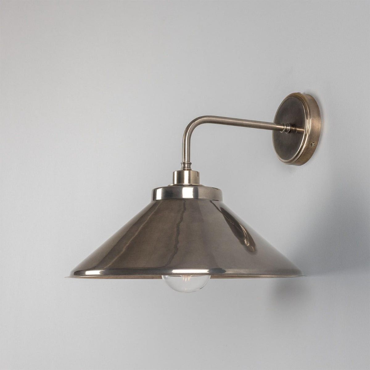 Nerissa IP65 Brass Bathroom Wall Light in Antique Silver and Clear Glass Shade