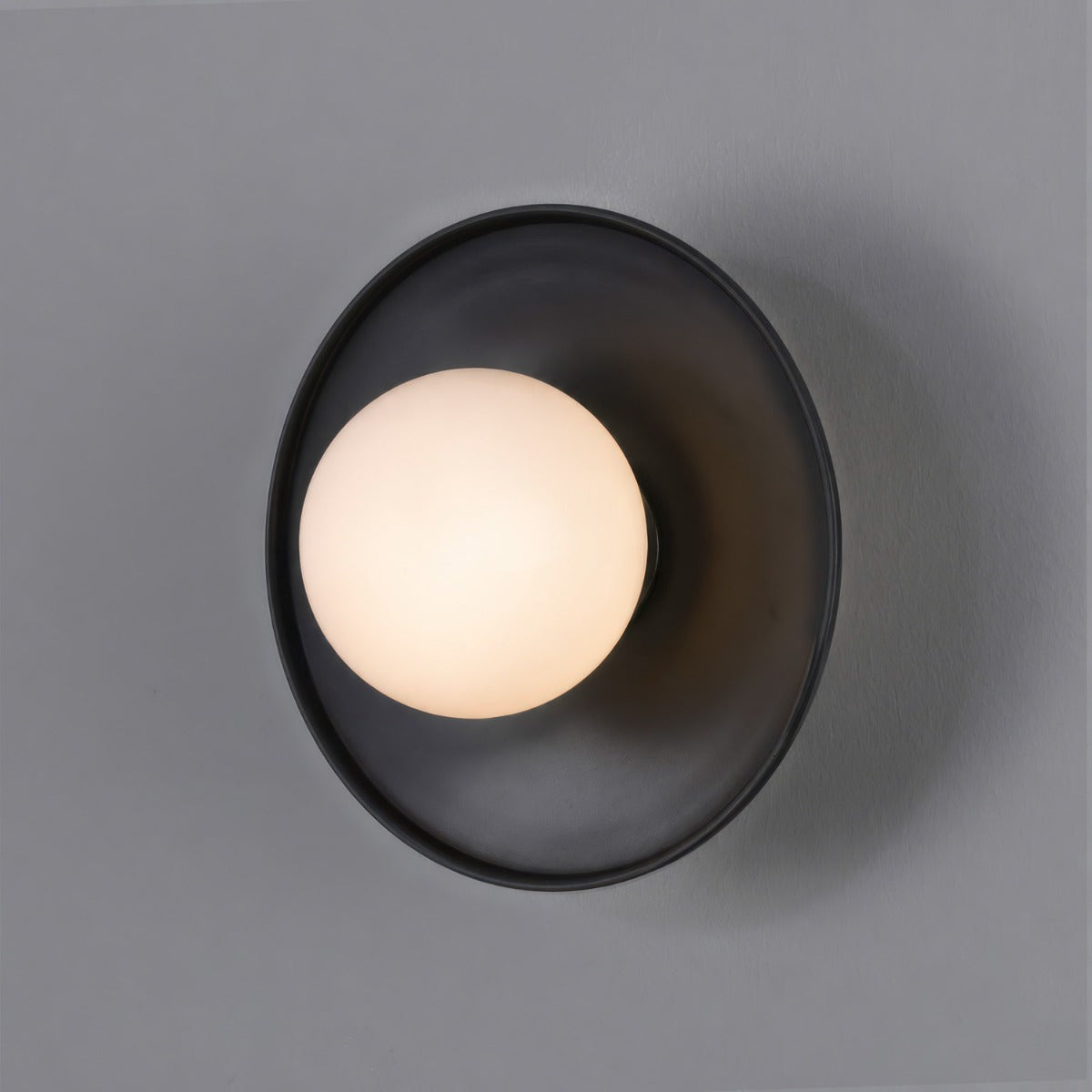 Aosta IP65 Brass Disc Bathroom Wall Light in Matte Black with Opal Glass Globe