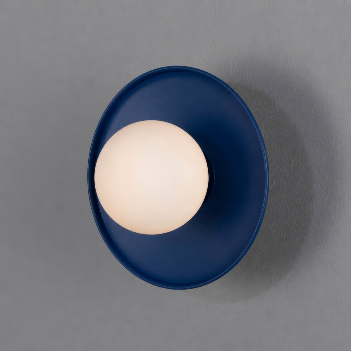 Aosta IP65 Brass Disc Bathroom Wall Light in Sapphire Blue with Opal Glass Globe