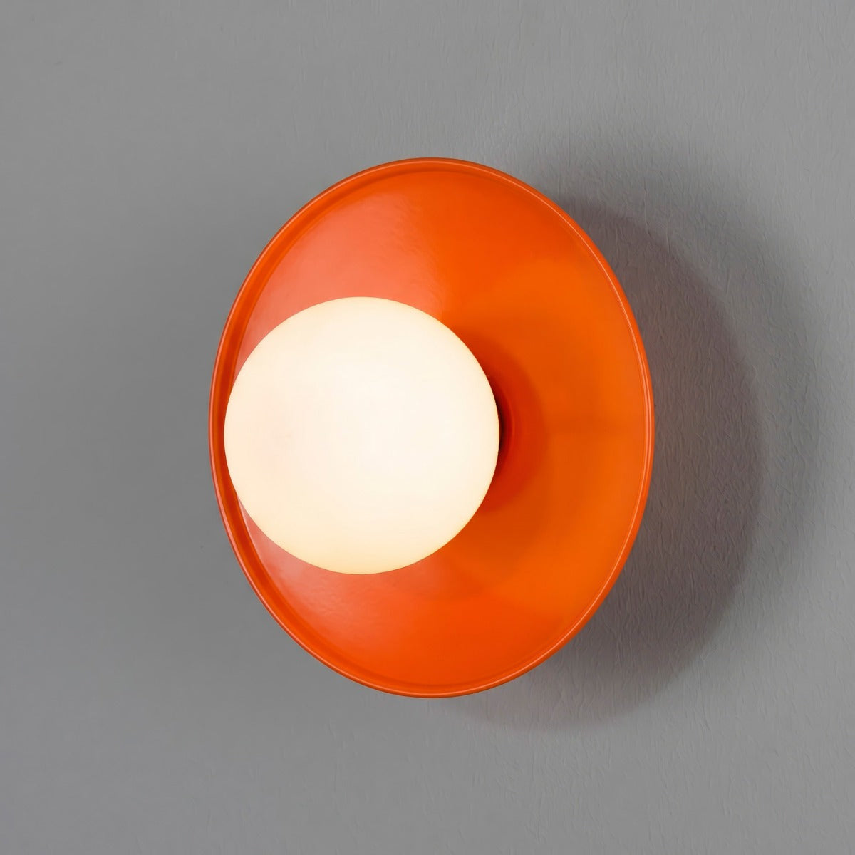 Aosta IP65 Brass Disc Bathroom Wall Light in Orange with Opal Glass Globe