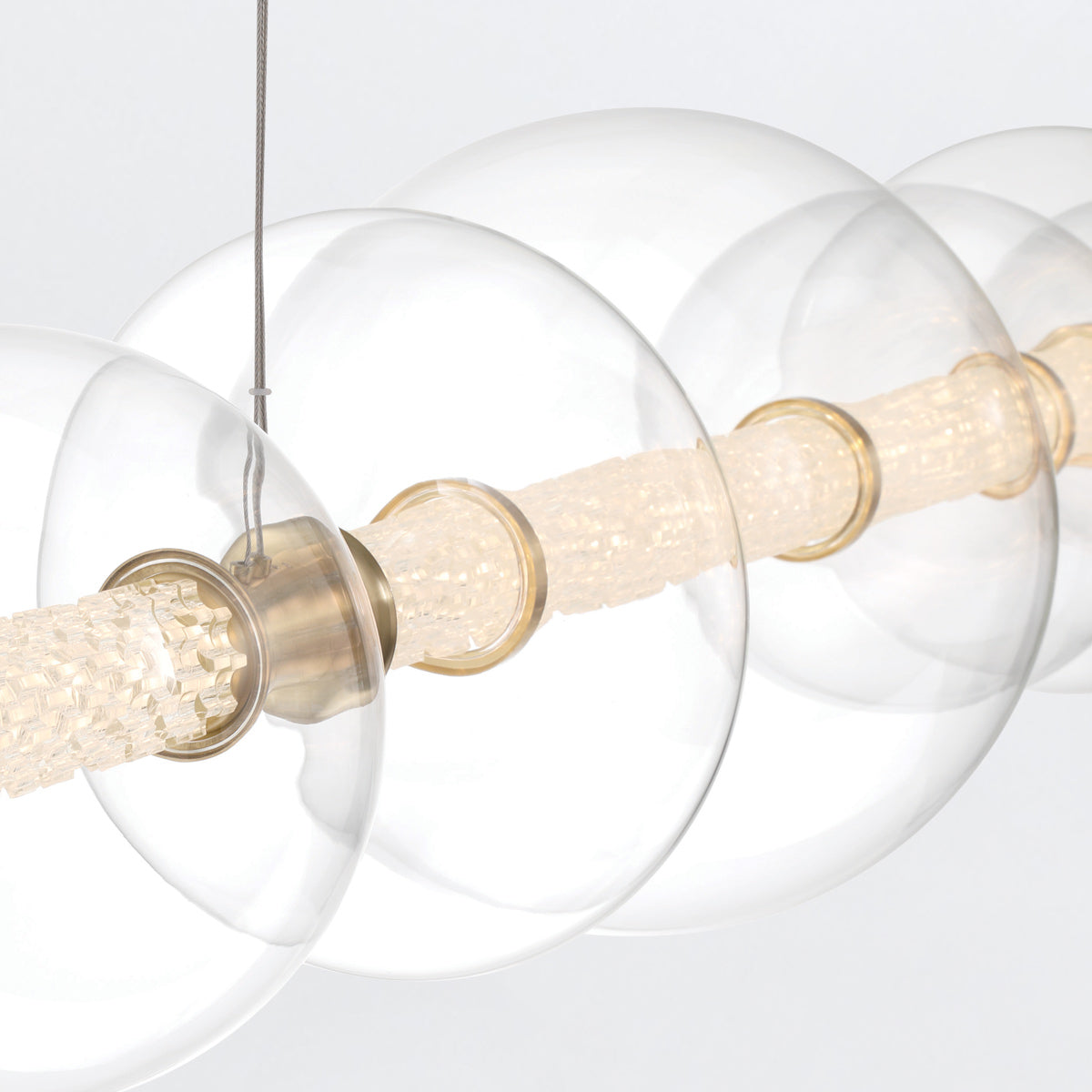 Atomo IP44 Seven LED Linear Pendant in Brushed Gold with Clear Glass Globes