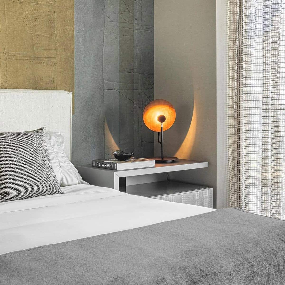 Accord Dot Natural Teak Wood Veneer Table Lamp on a bedside table next to a bed