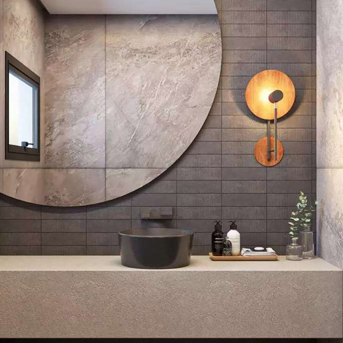 Modern bathroom with a round mirror, dark gray sink, and a unique wooden wall light