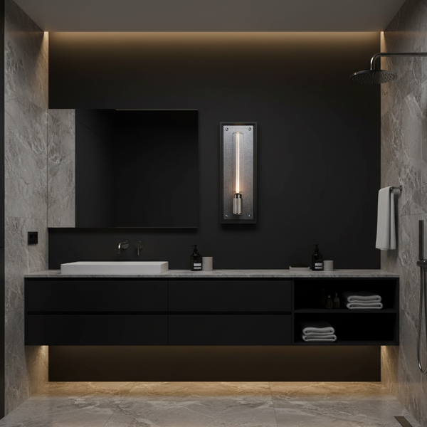 Modern bathroom with black vanity, white sink, large mirror, and a vertical wall light