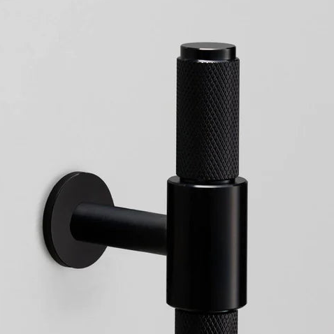 Black knurled metal T-bar handle with a round base